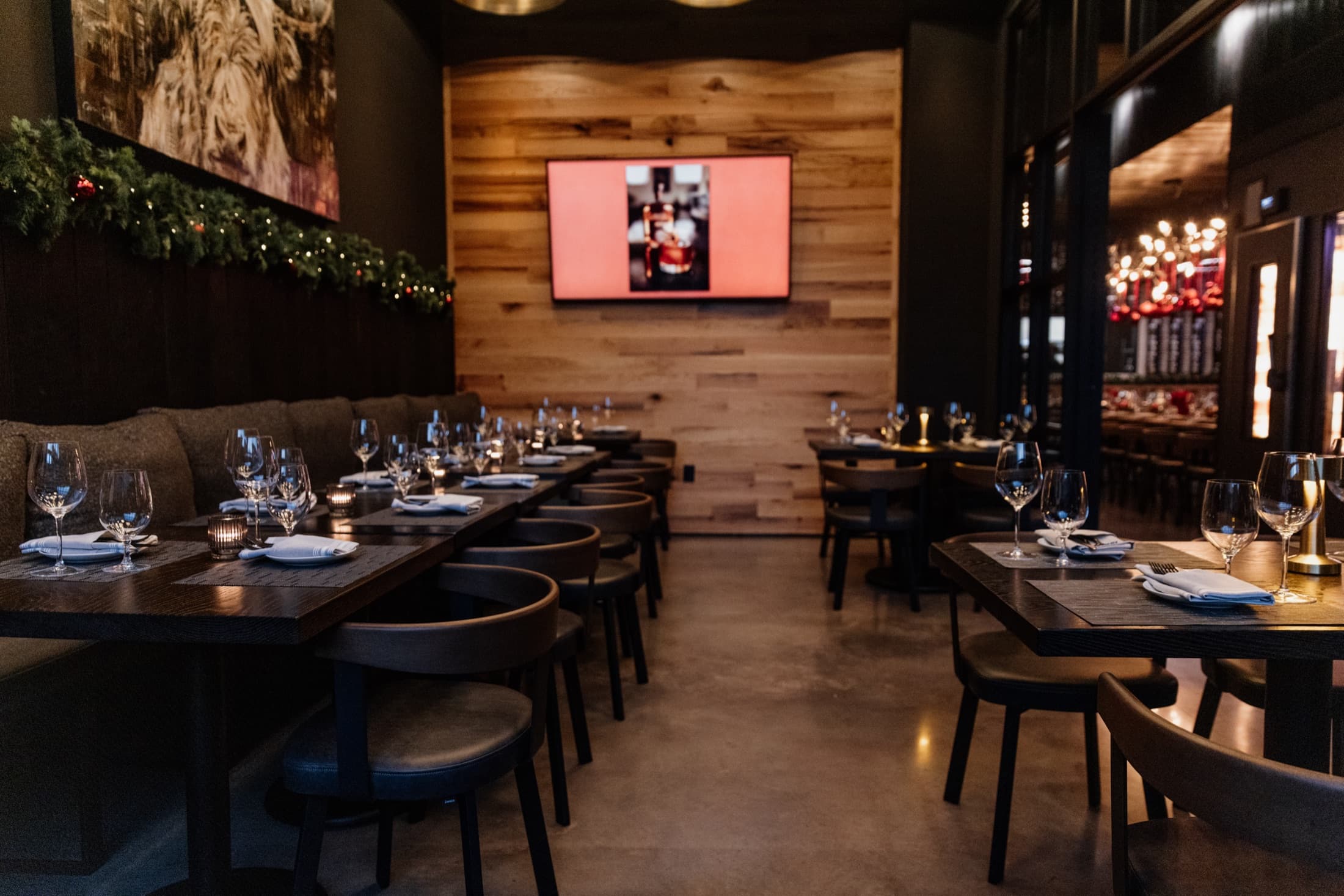 The private dining room at CHR Steak with a 75-inch television for presentations
